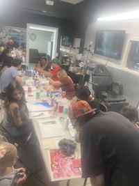 a group of people sitting around a table