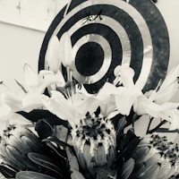 a black and white photo of a flower arrangement