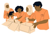 a group of people are putting boxes together