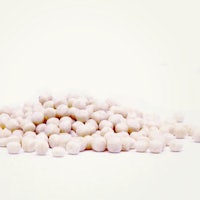a pile of white peas on a white background