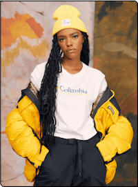 a woman wearing a yellow jacket and t - shirt