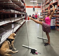 a woman and her dog standing in a store
