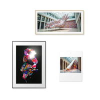 a collection of framed art, including a sculpture and a painting