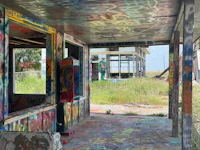 an abandoned building covered in graffiti