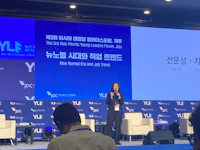 a woman giving a speech at a conference