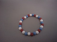 a bracelet with red, white and blue beads