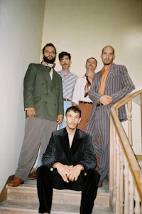 a group of men posing for a picture