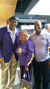 two men and an older woman posing for a picture