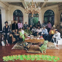 a group of people posing for a picture in a living room