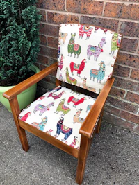 a chair with a colorful llama print on it
