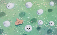 a group of small white animals in a grassy field