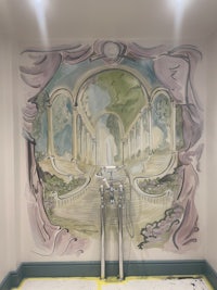 a mural painted on the ceiling of a room