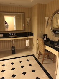 a bathroom with a mirror and a sink
