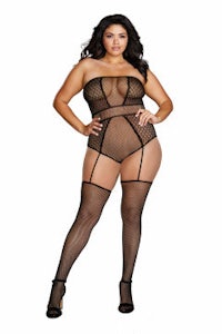 a woman wearing a fishnet bodystocking and stockings