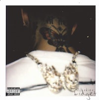 the back of a man with tattoos on his neck
