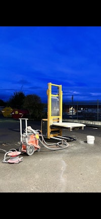 a machine is in the middle of a parking lot