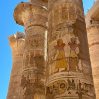 egyptian pillars with carvings on them