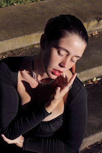 a woman wearing a black dress