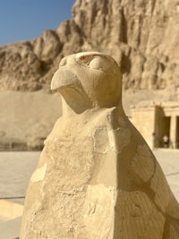 a statue of an eagle in front of a building