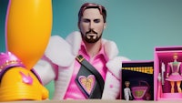 a man in a pink suit is holding a pink toy