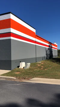 an orange and white stripe on the side of a building
