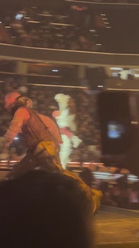 a man is on a stage in front of a crowd