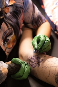 a woman with a flower tattoo on her back