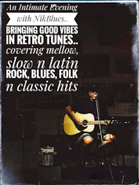 a man is playing an acoustic guitar