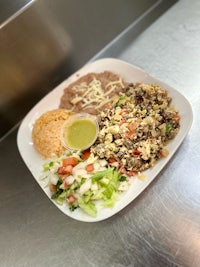 a plate of mexican food sits on a counter