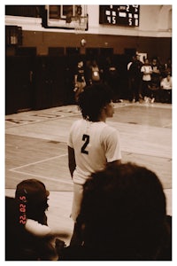 a black and white photo of a basketball player