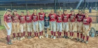 the softball team is posing for a picture