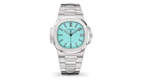 a women's watch with a turquoise dial