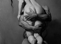 a black and white painting of a woman hugging a man