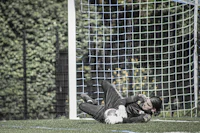 a person laying on a soccer field