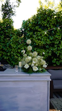 a white table with flowers on it