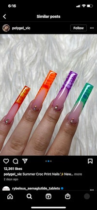 a person's nails are shown with different colors on them