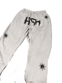 a pair of sweatpants with the word hsh on them