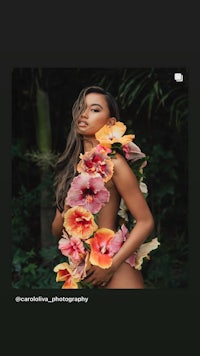 an image of a woman posing with flowers