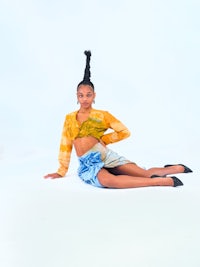 a young woman posing on a white background