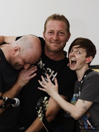 three people posing for a picture