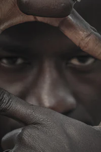 a man is holding his hands up to make a circle