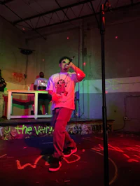 a man standing on stage with a microphone