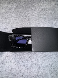 a pair of sunglasses in a black box