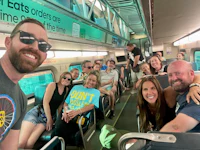 a group of people on a train taking a selfie