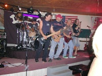 a group of men playing guitars