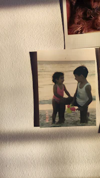 a photo of a girl and a boy on a wall
