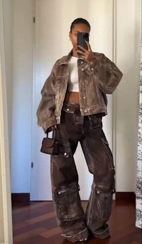 a woman is taking a selfie in a mirror