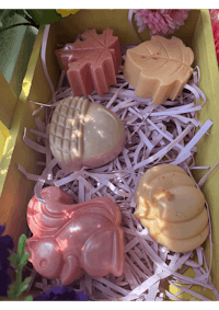 a box filled with soaps and flowers