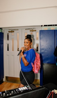 a woman singing into a microphone