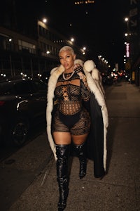 a woman in thigh high boots and a fur coat